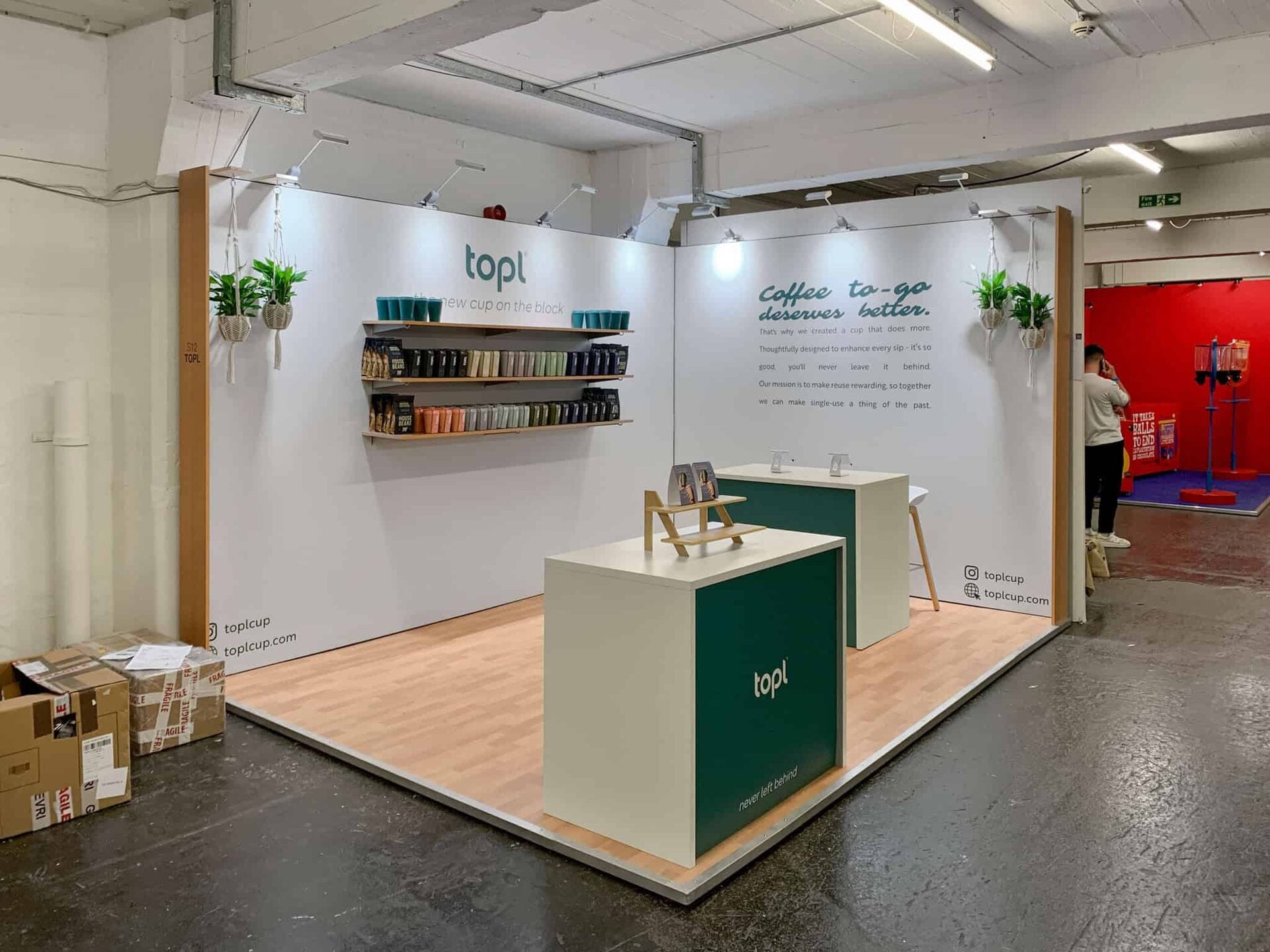 Modular trade show booth – minimalist white corner stand with Topl branding, cube...