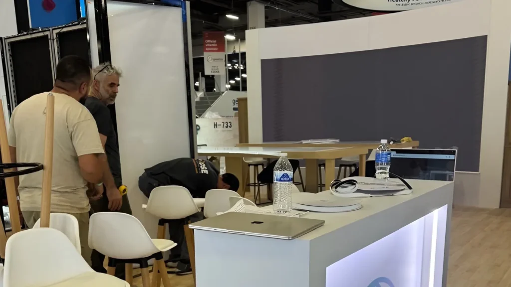 Inspection of the One Innovation Labs trade show booth designed and built by Booth Exhibits™.
