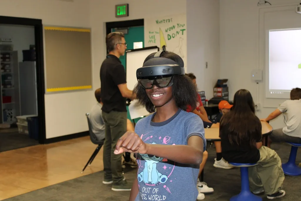 A child interacting with a VR headset in real time. 