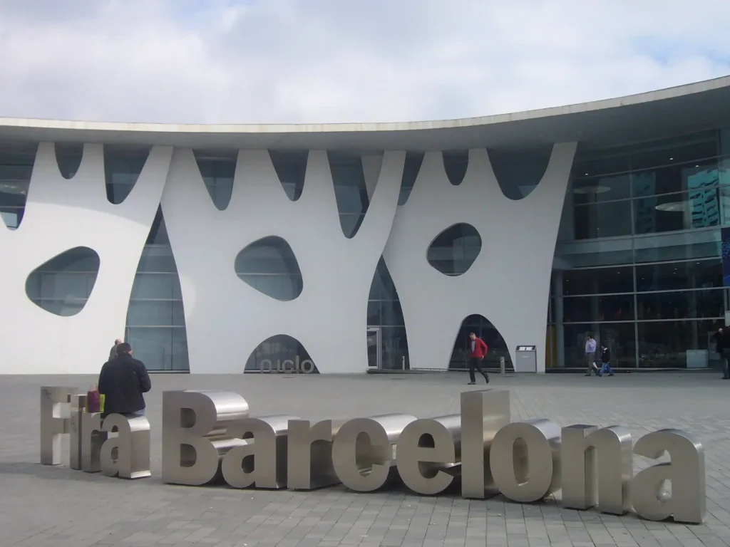 FIRA Barcelona venue exterior with a bench in the foreground stylized like the venue name.