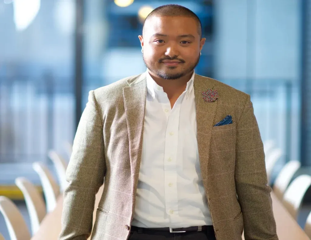 A man wearing business casual attire.