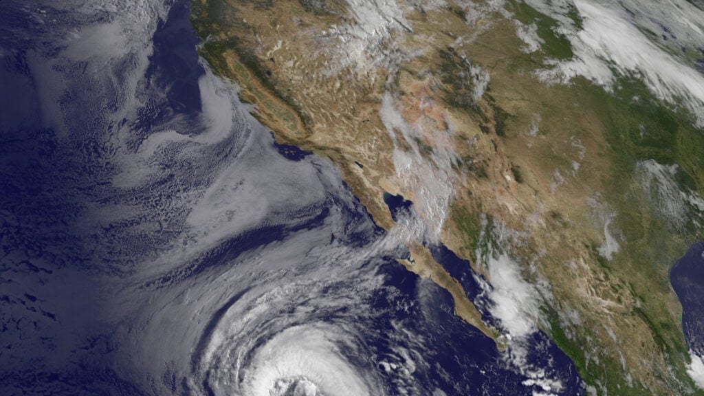 Satellite image of Earth showing a storm approaching Baja California.