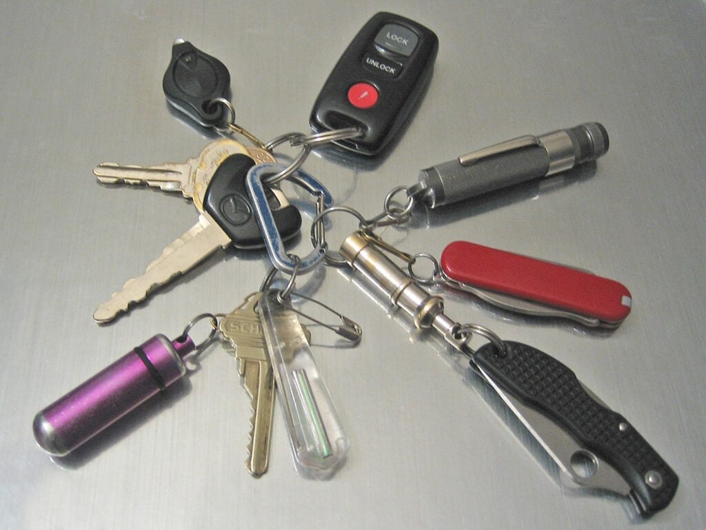 A variety of keychains attached to a keyring.