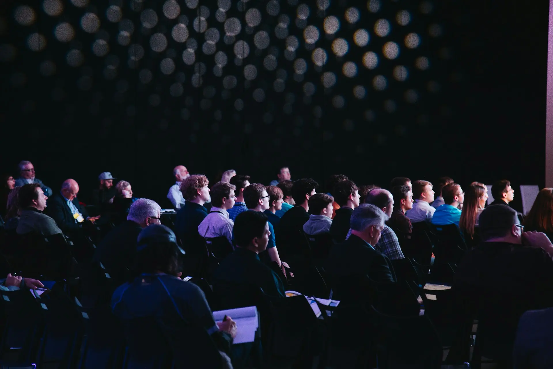 A group of people attendees at a tech show conference.