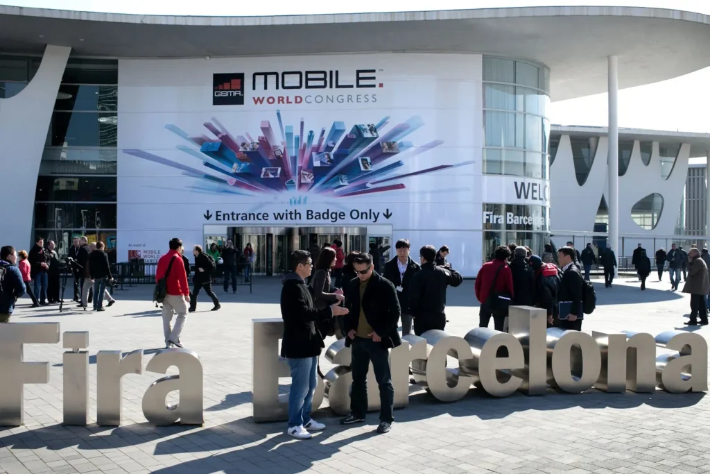 People congregate outside the Fira Gran Via in Barcelona during Mobile World Congress. 