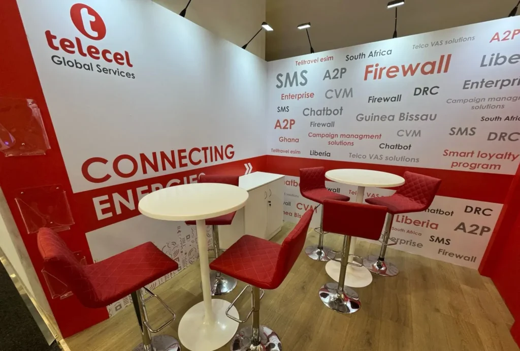 Outdoor meeting area at Telecel's 2024 AfricaCom booth designed by Booth Exhibits™. 