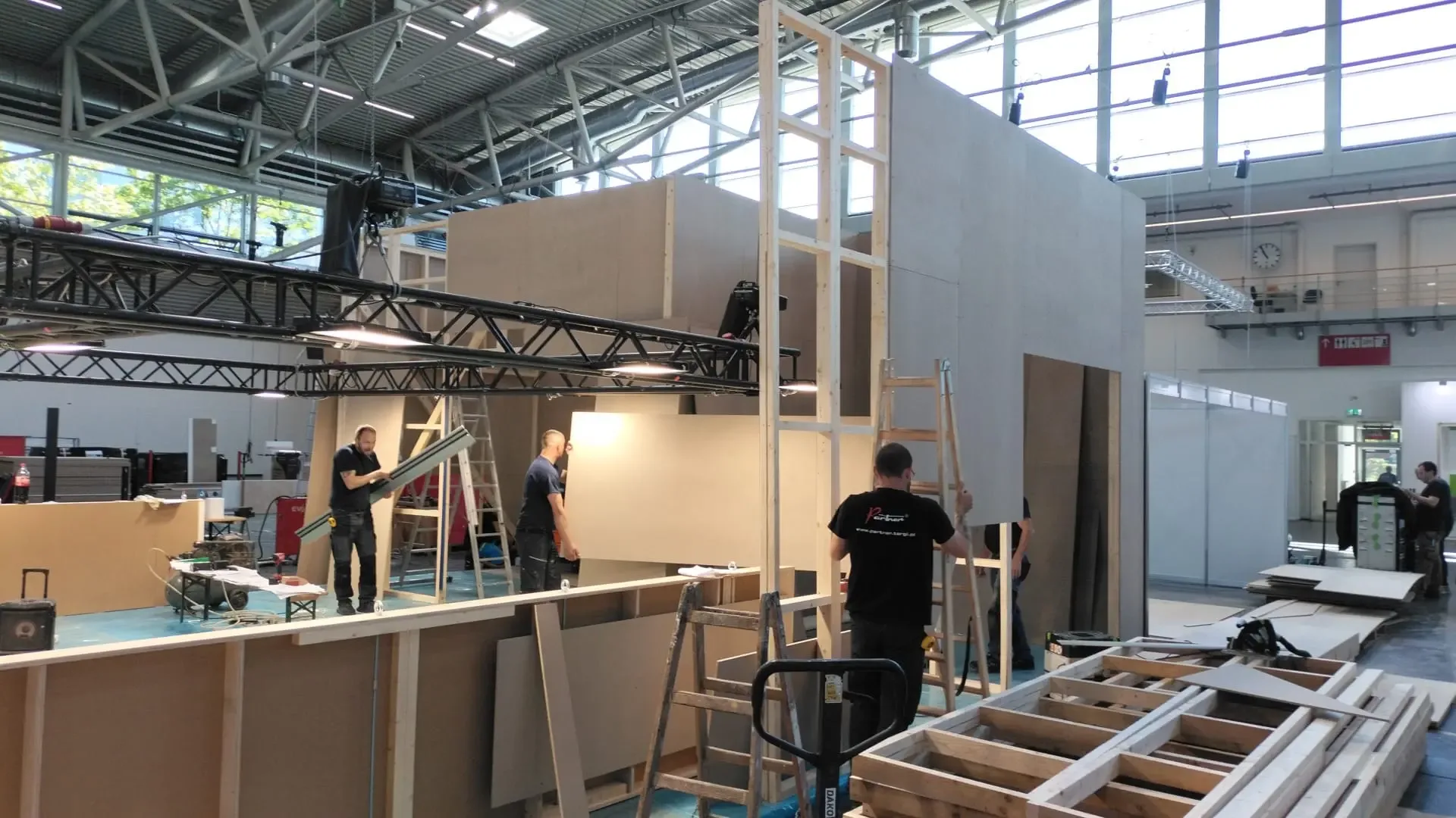 Workers building the Array's 2025 exhibition booth at Intersolar in Munich.
