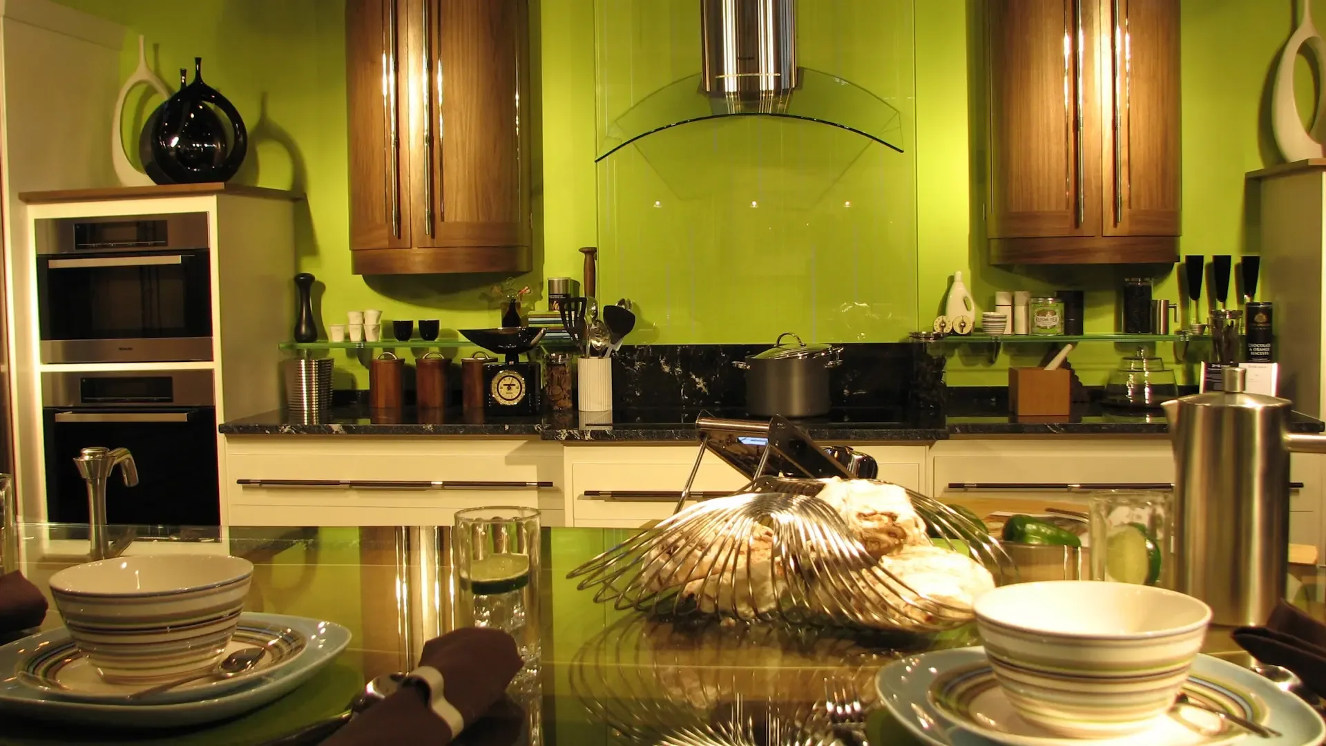 Modern kitchen with green accents.