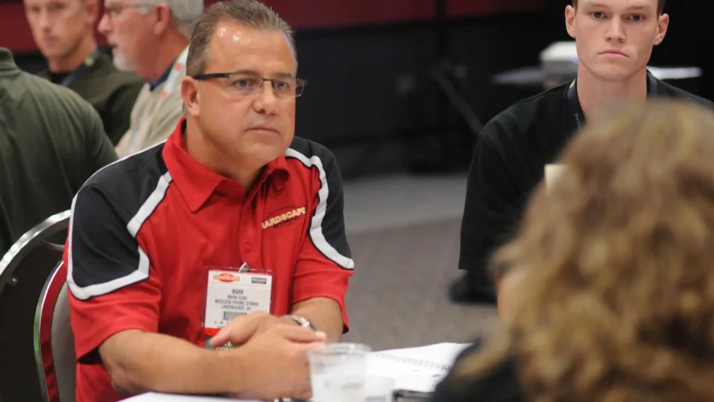 Two attendees discuss business at the Equip Expo.