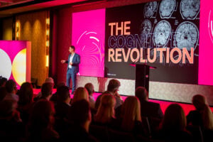 Speaker presenting on cognitive revolution.