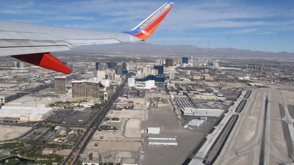 View of Harry Reid International Airport from outside an airplane window. 