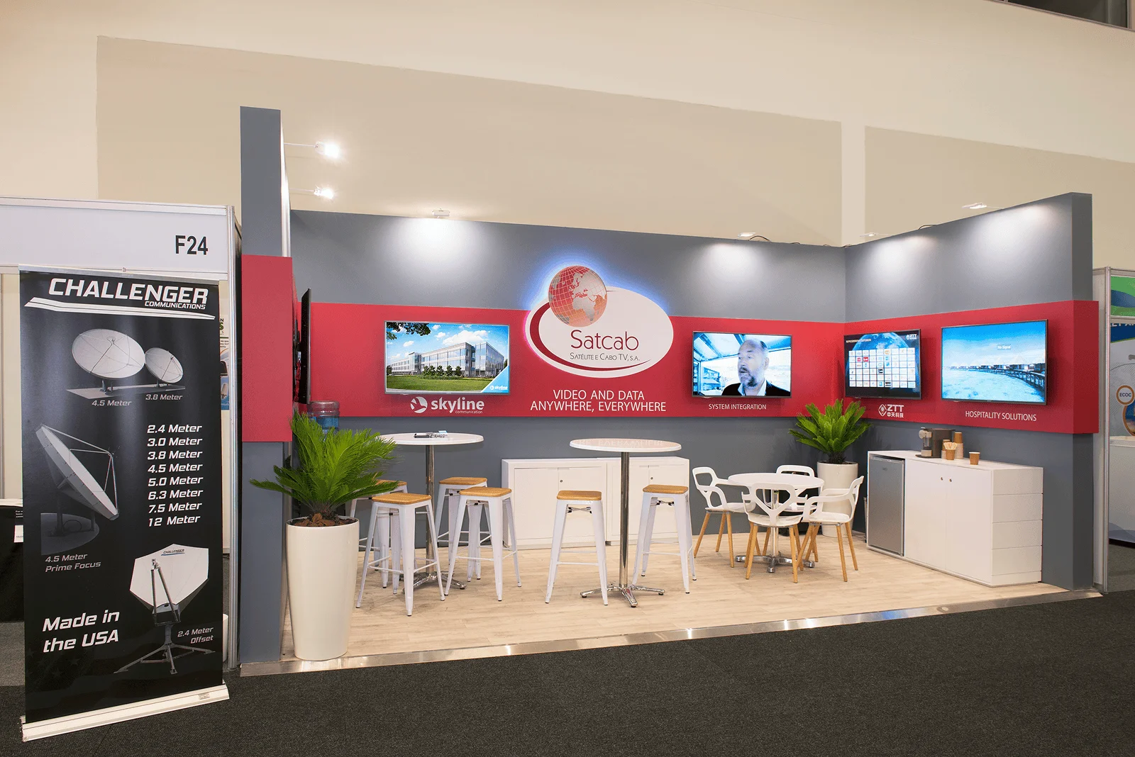 Satcab inline exhibition stand with red and white branding