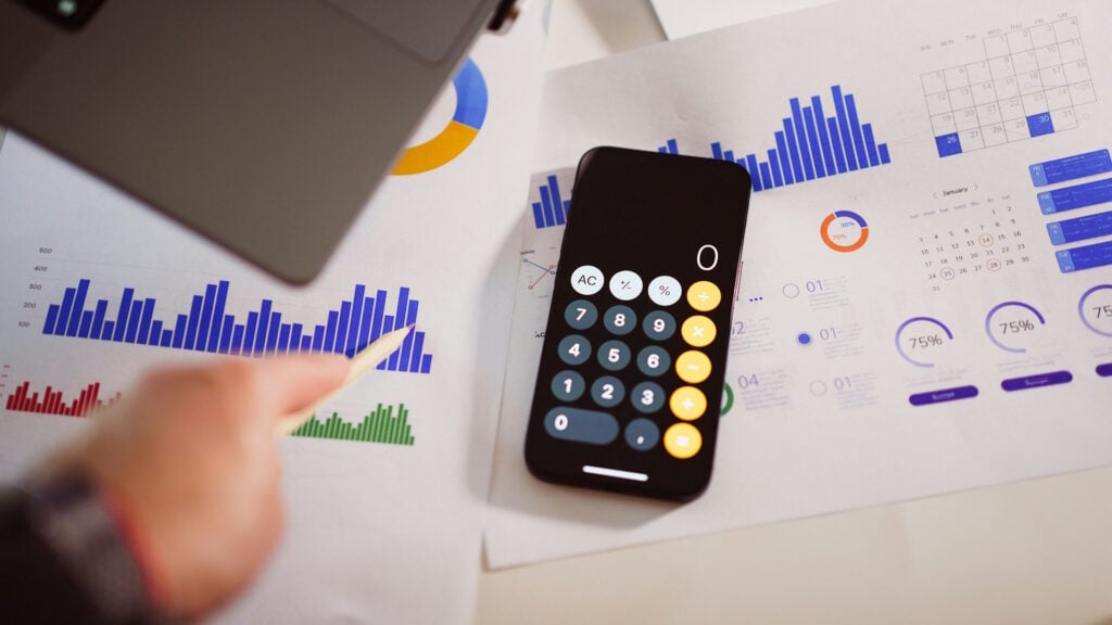 Calculator and graphs on a table.