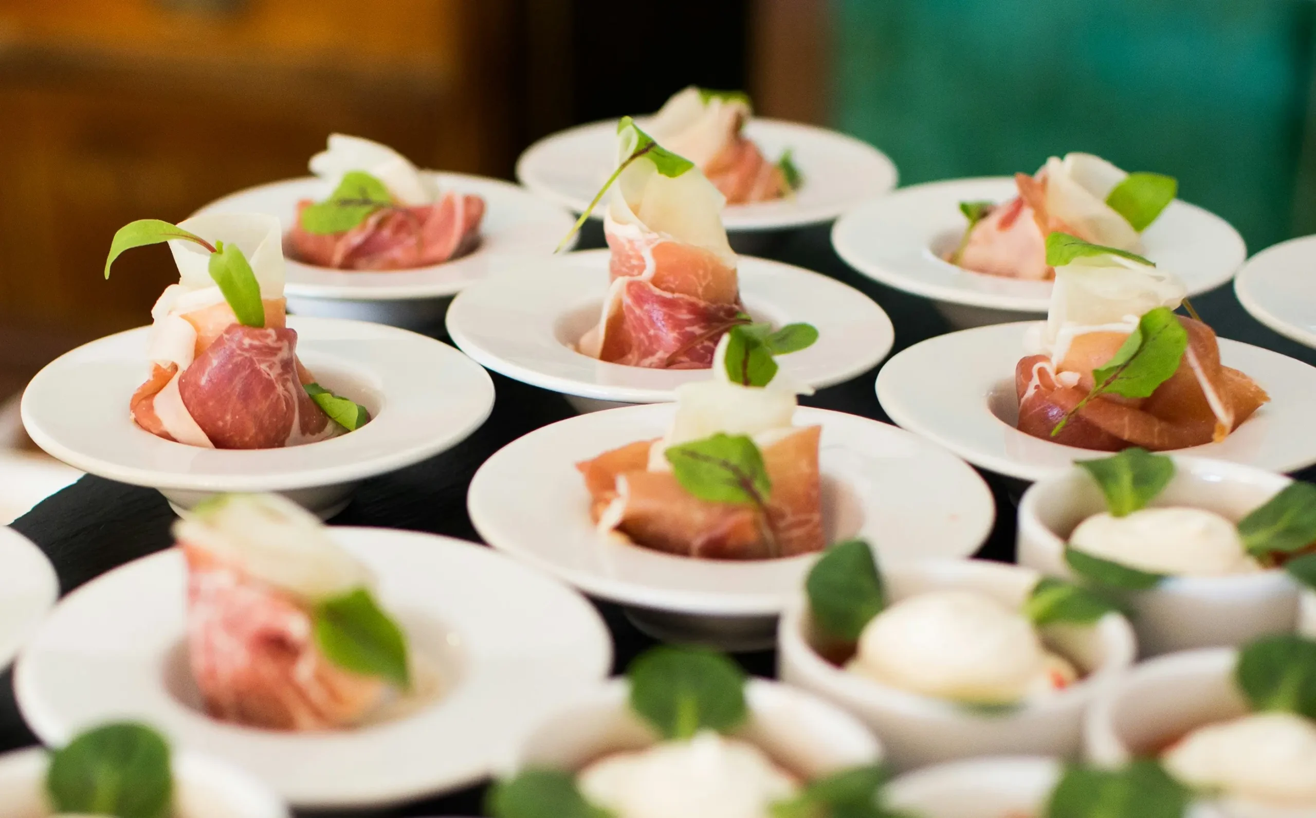 Elegant sushi appetizers on small plates.